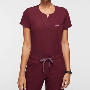 Jaanuu scrub set. 1 pocket tuck in top. Essential 5- pocket joggers. Wine color.